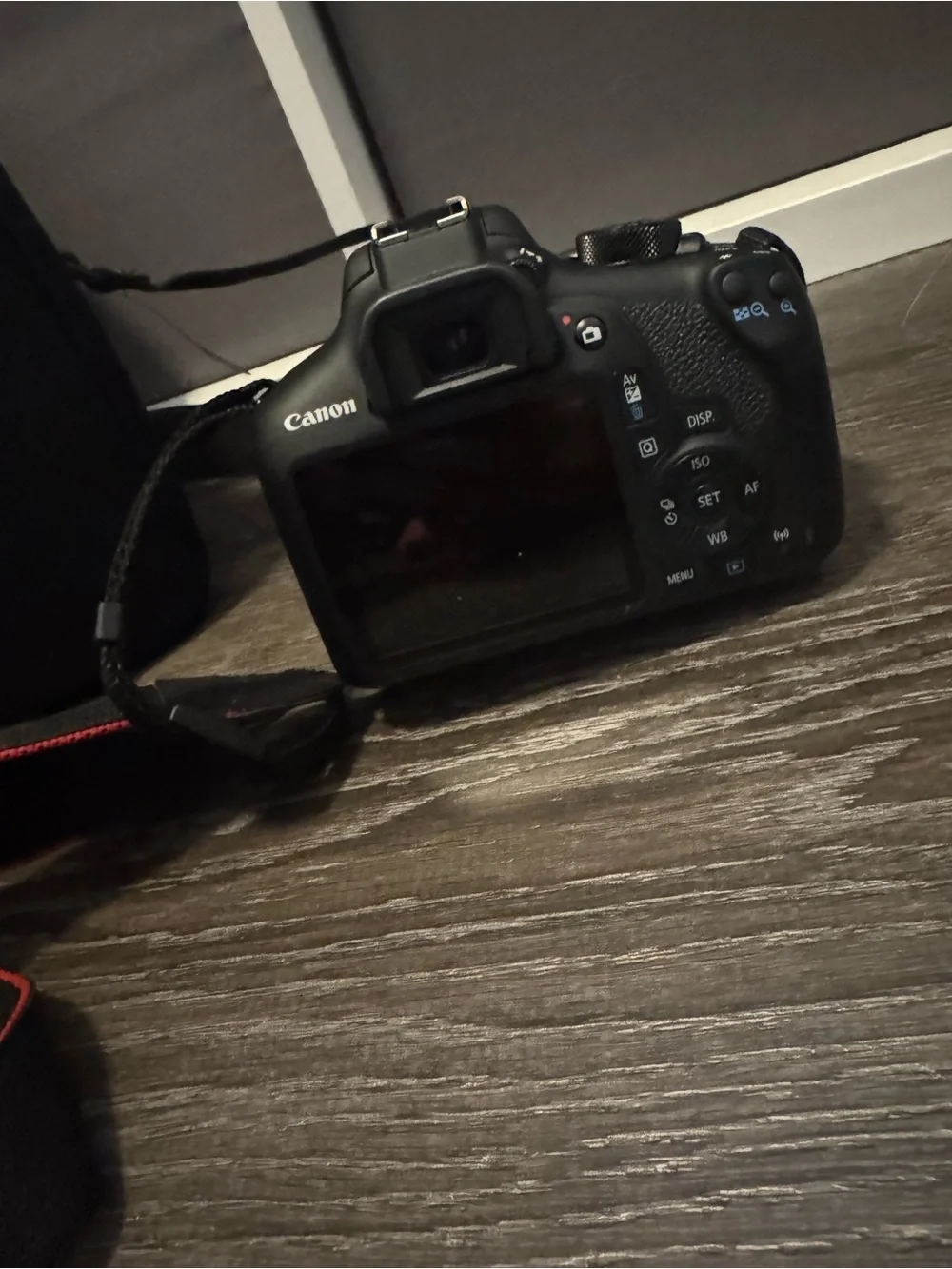 Canon Rebel T6 Camera with Black Body and Red-Trim Strap